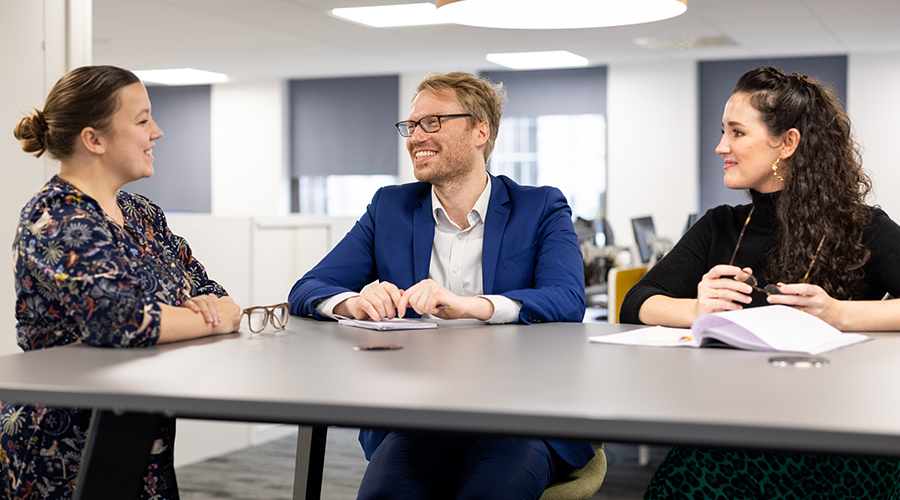 three lawyers having a discussion in our Cheltenham office