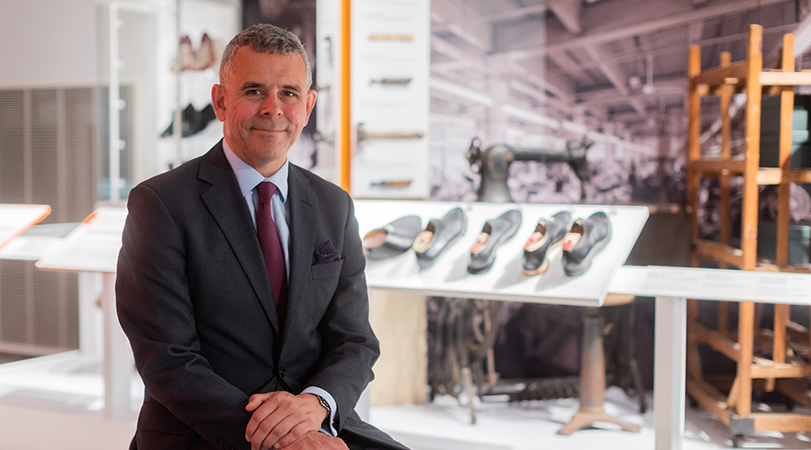 Lawyer standing in front of shoes business