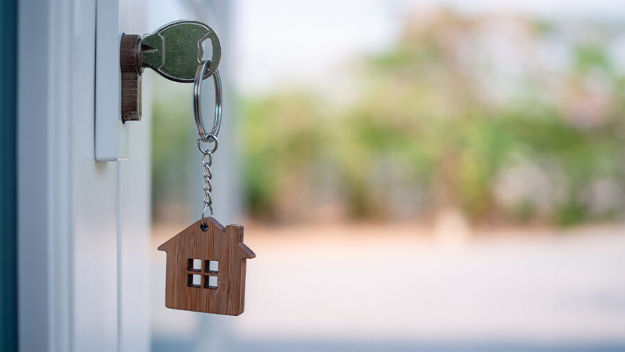 Picture of a key in a house front door