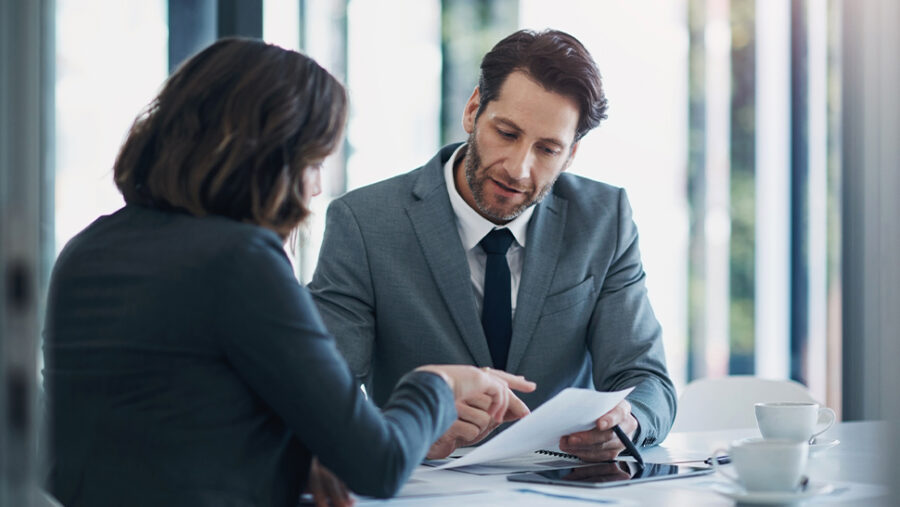 Image of two business people discussing something