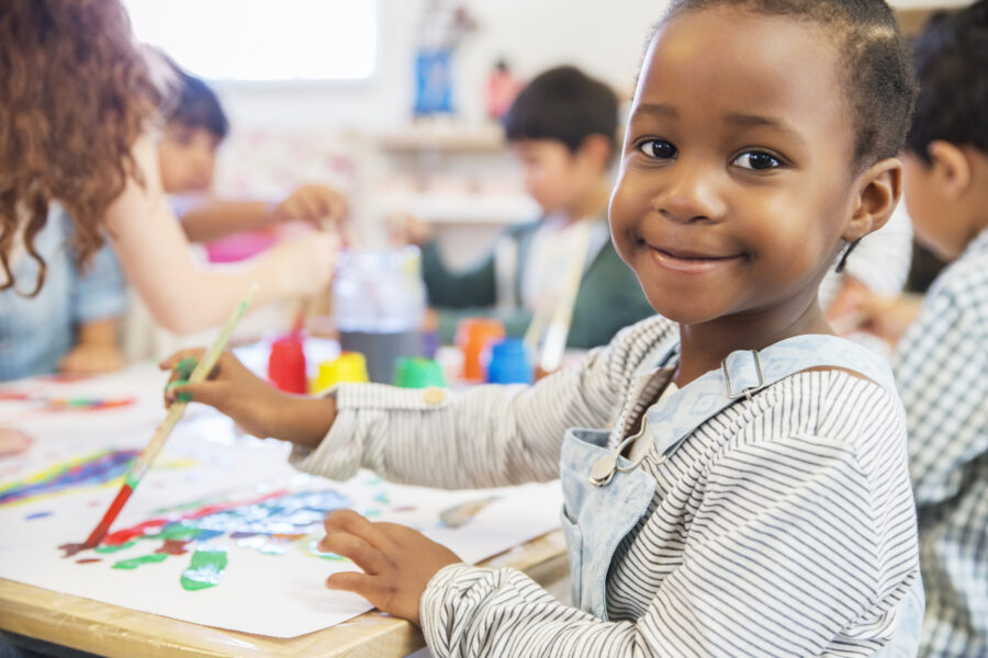 A photo of an infant at an early years school