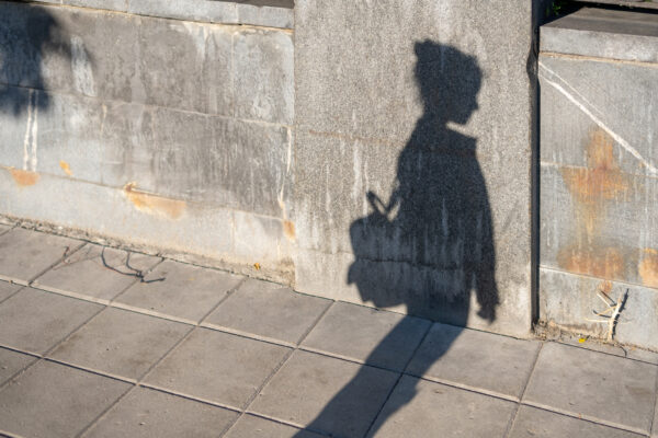 A shadow of a school kid