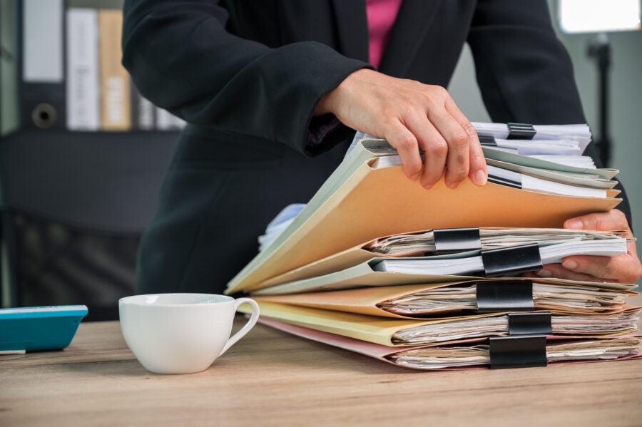 A woman checking through records