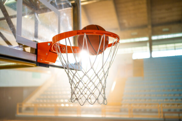 A basketball going through a hoop