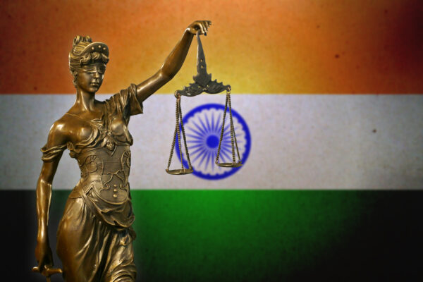 Lady justice infront of an indian flag