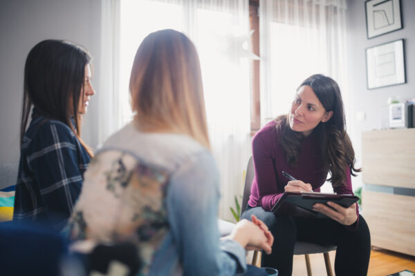 A social worker with two clients