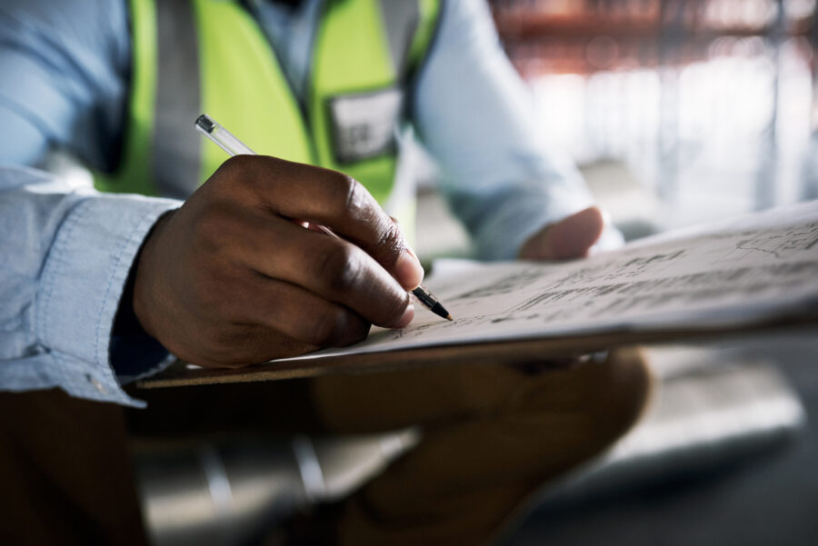 A man filling out a building report