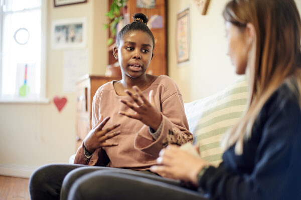 A photo of a teenager with a carer