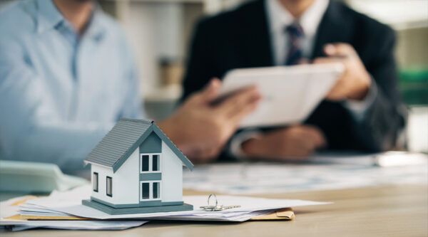 Couple sitting at the table, looking at documents