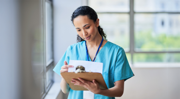 Female healthcare provider looking at documents