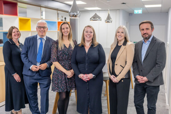 Group of new joiners partner, looking at the camera and smiling