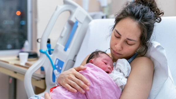 Picture of a mother with her child in hospital after birth