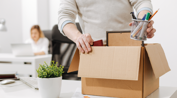 An employee packing their box