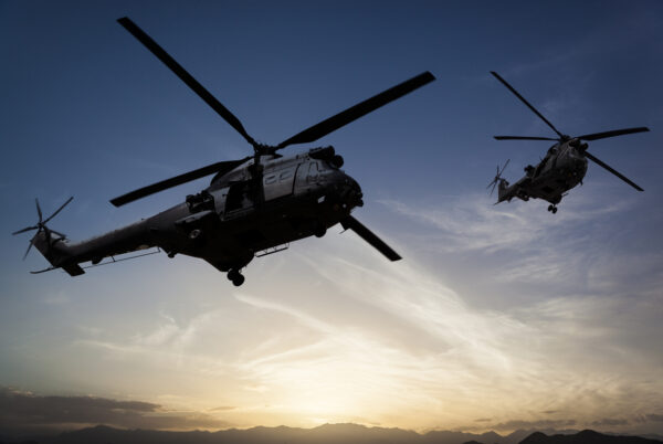 Two Puma helicopters flying