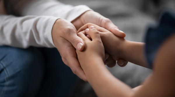 A child holding hands