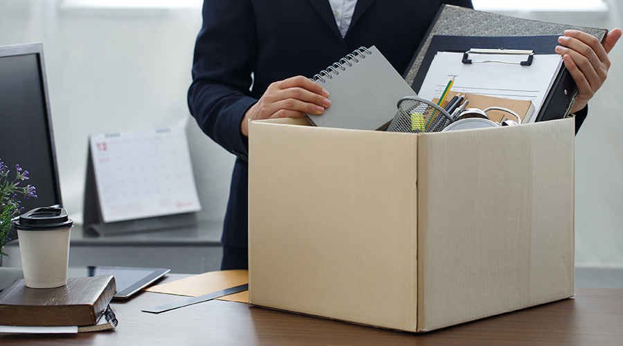 An employee packing their desk