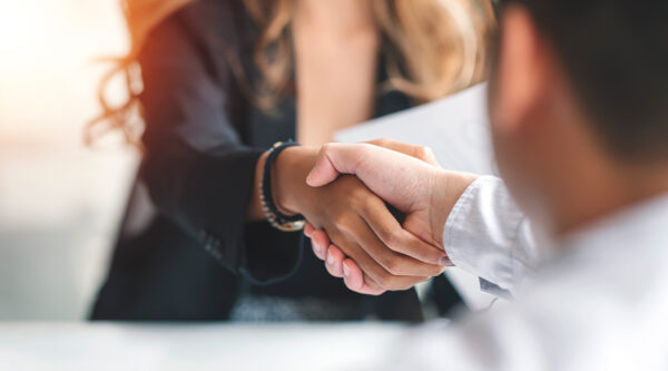 Two businesspeople shaking hands